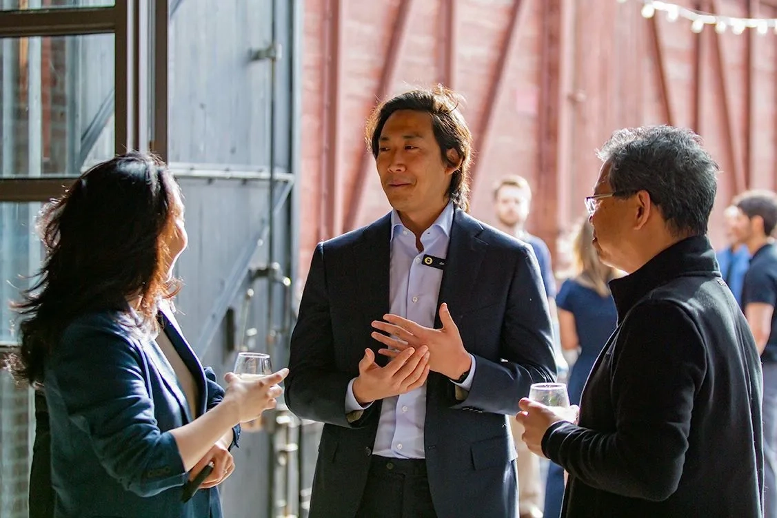 Betty team members talking together at a company event.